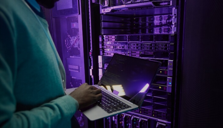 Man in dark server room